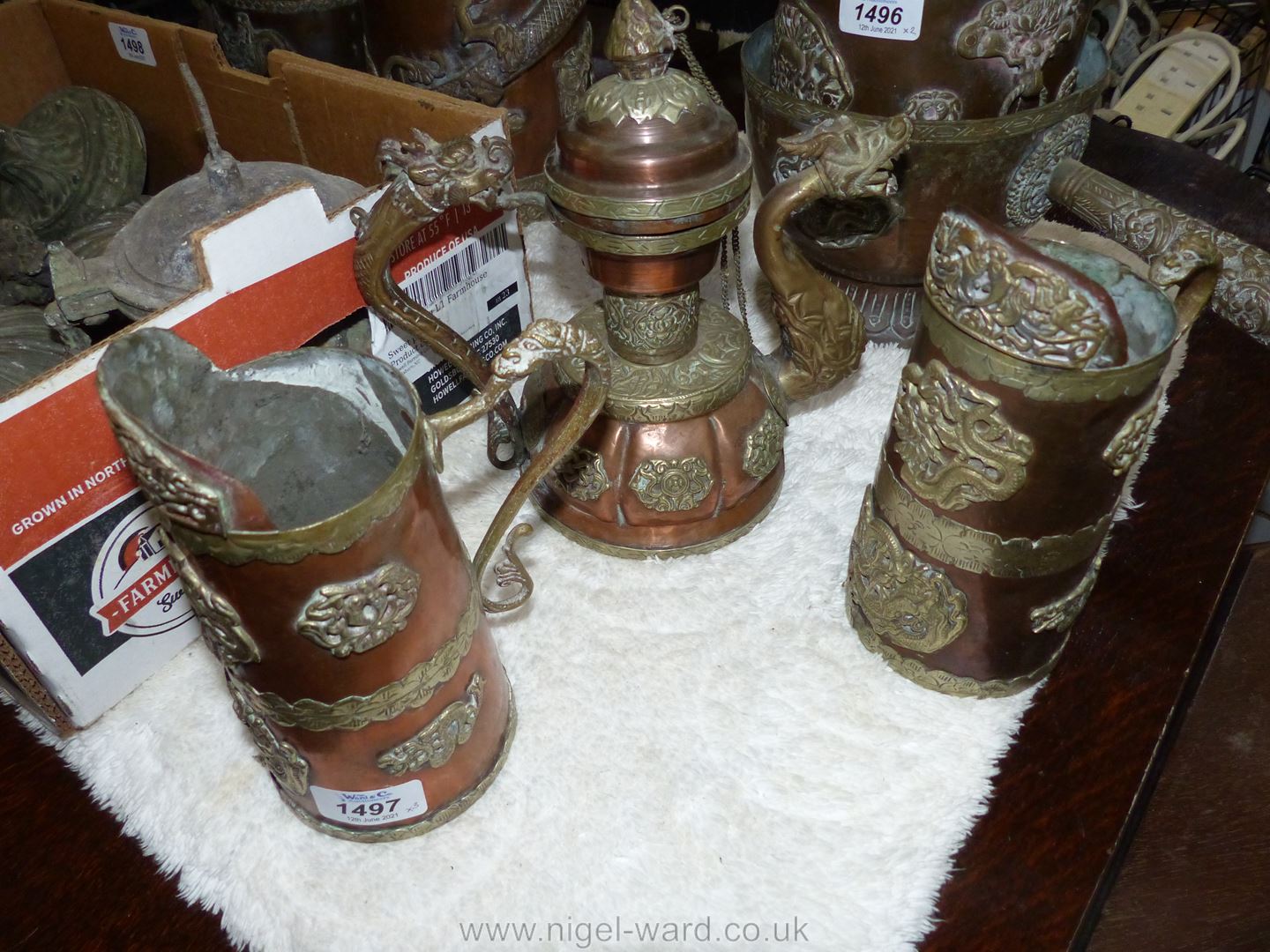 A small copper and brass ceremonial Dragon teapot with lid on chain,