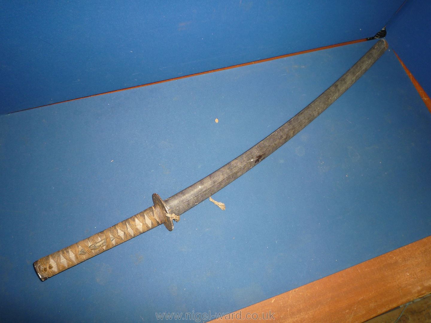 A remarkably sharp edged Samurai Sword/Katana, the blade rust marked,