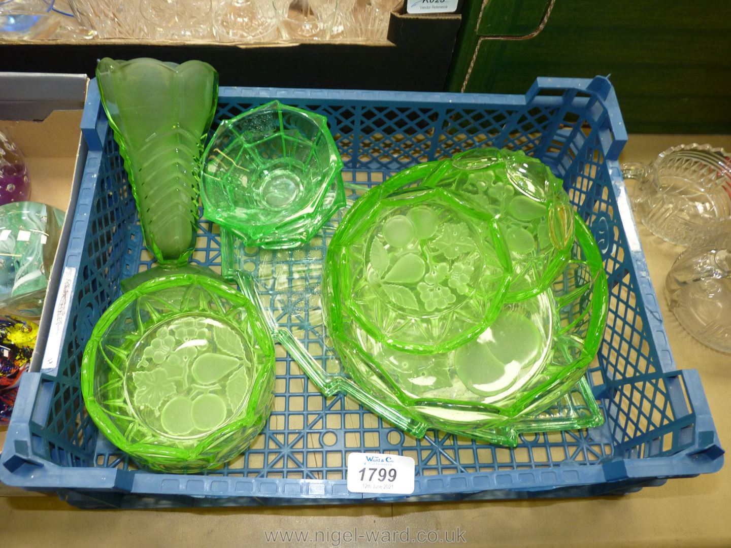 An Art Deco green Uranium glass dressing table set, green glass fruit set and vase.