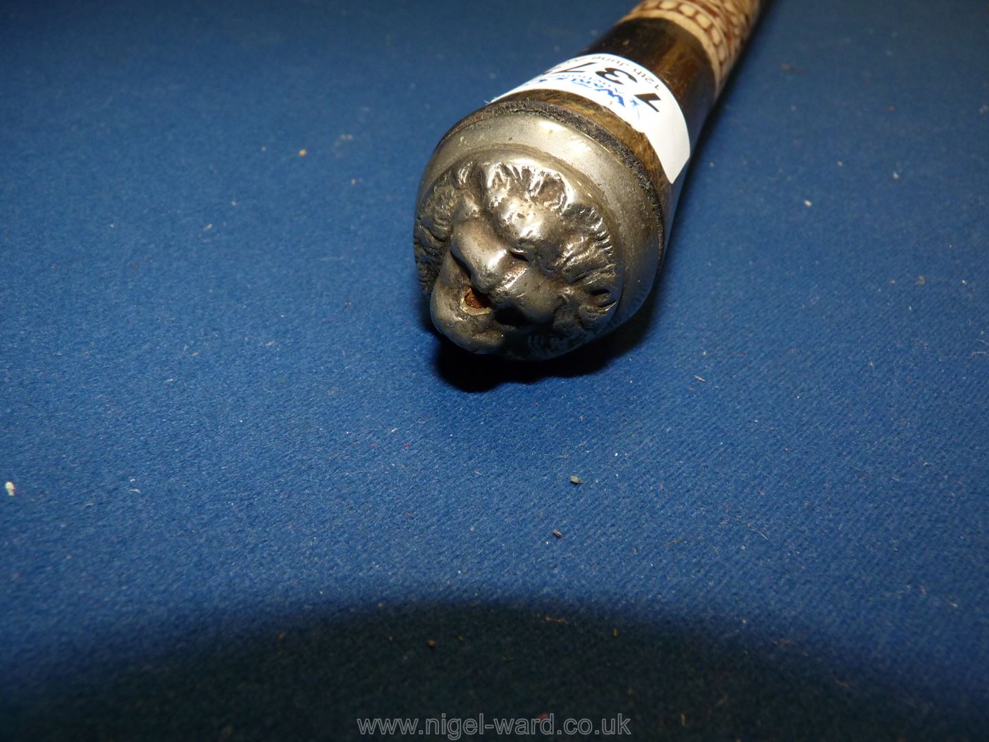 A wooden and ebony swagger stick having carved bone decoration and carved lion top. - Image 2 of 2