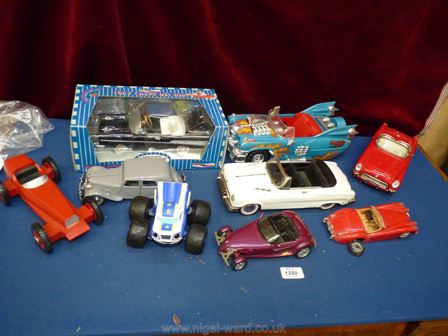 A box of classic vehicles (8+) including boxed Chevy 57.