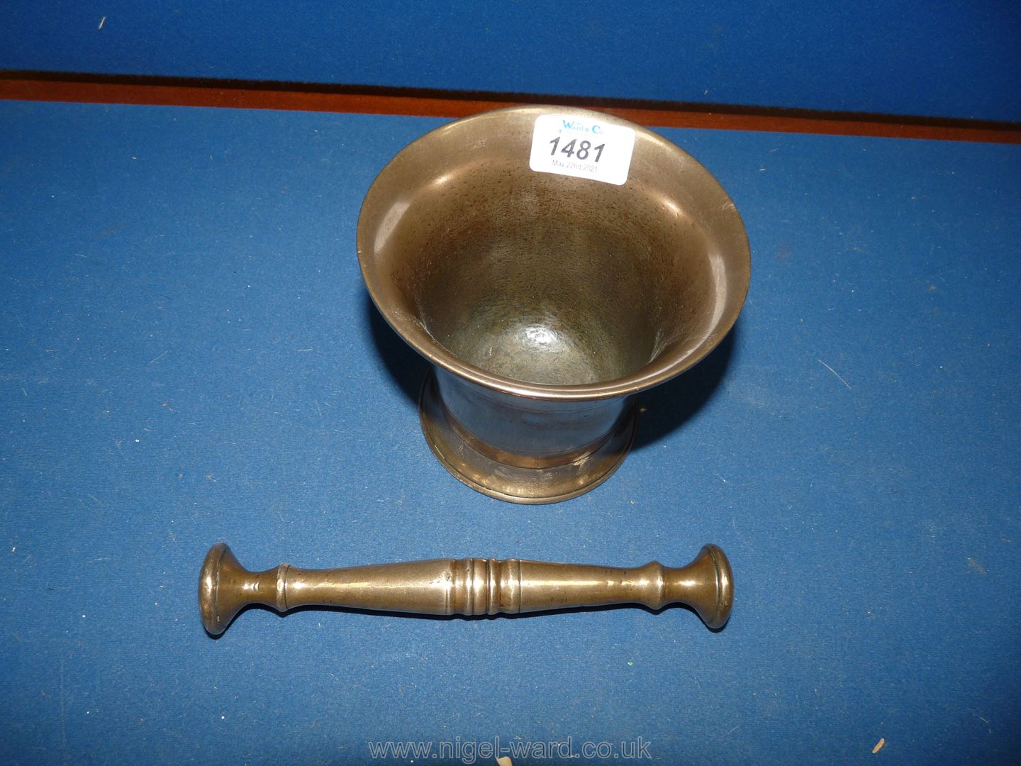 A fine old bell metal Pestle & Mortar, shiny from use,