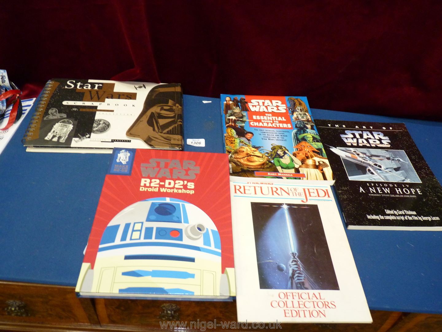 Five large Star Wars books.