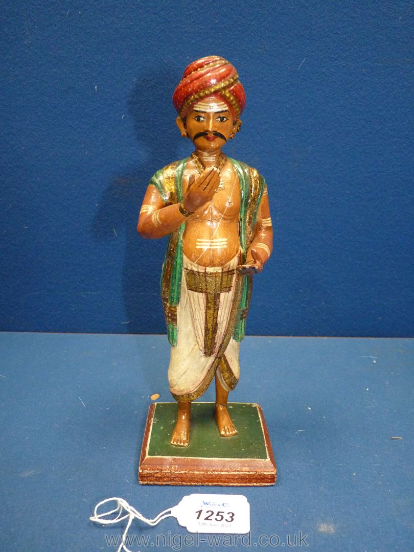 A very good Indian carved wood figure of a wealthy Hindu devotee or pilgrim, circa 1900,