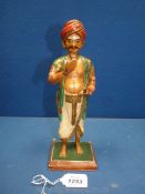 A very good Indian carved wood figure of a wealthy Hindu devotee or pilgrim, circa 1900,