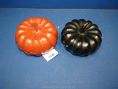 Two small Burmese (hsun ok) offering bowls, of melon form, 6'' diameter. One red, the other black.