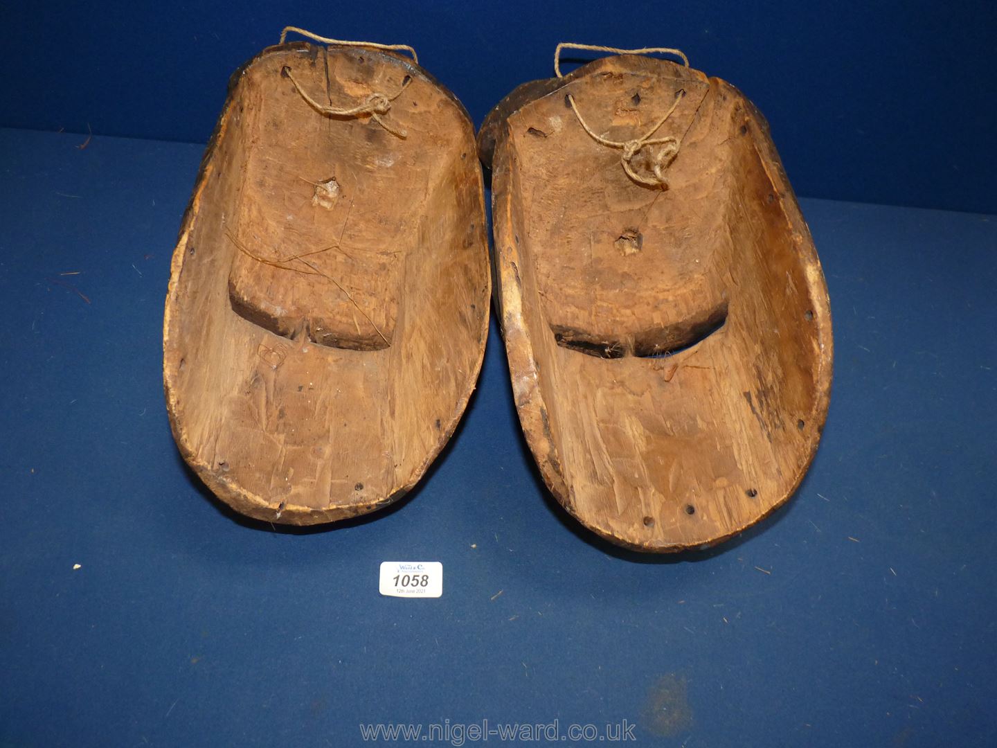 Two hand carved African face masks with white painted eyes, lightweight, possibly cork, 12" tall. - Image 2 of 2