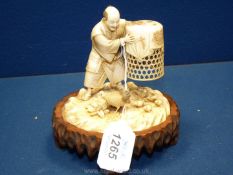 A very fine Japanese Meiji period Tokyo School ivory Okimono of a chicken seller,