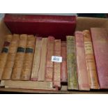 A box of books including Charlotte Bronte, The Story of Alfred the Great,