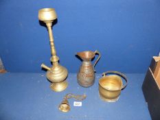 An Eastern brass hookah pipe, jug, bell and miniature coat scuttle.