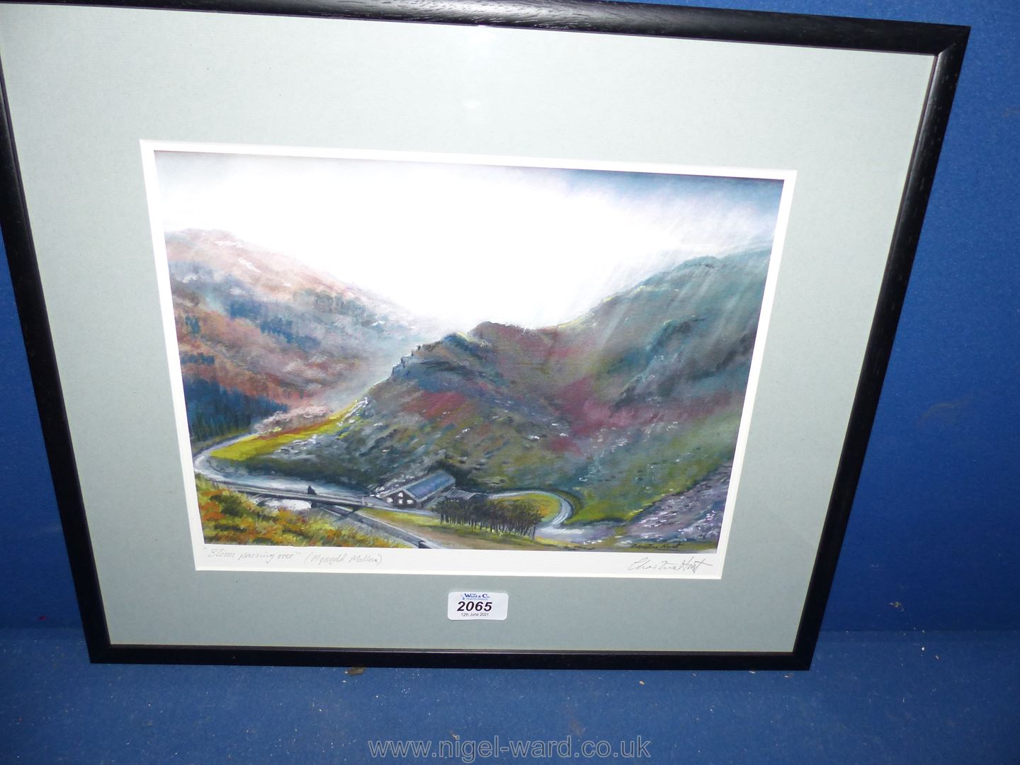 A framed and mounted Print "Storm passing over" (Mynydd Mallaen) signed Christine Hunt,