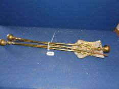 A set of three Art Nouveau brass fire irons.