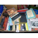 A box of books including How to change the World, Guardians of Power, The Good Liar, etc.