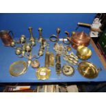 A quantity of brass and copper including teapot, ship bookends, dishes, scales etc.