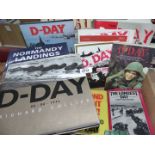 A box of D-Day books including one relating to Badges, uniforms, equipment, etc.