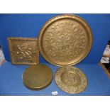 A collection of brass chargers, gong, square lion picture etc.