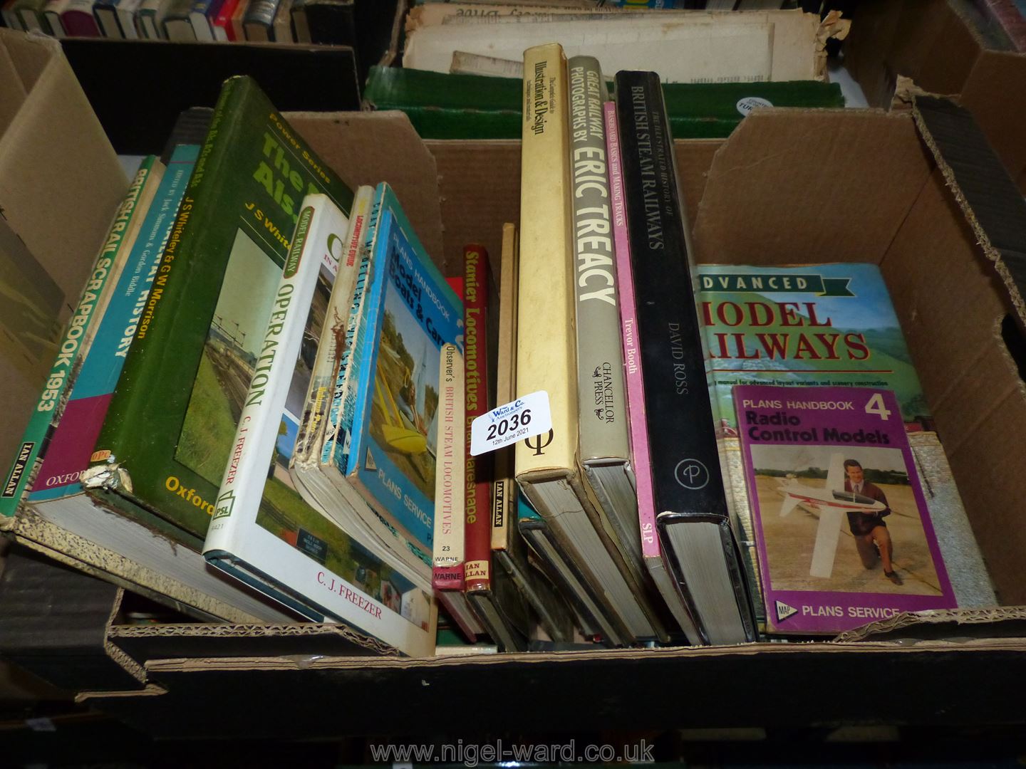 A box of books including British Railway history, Stanier locomotives, model boats, etc.