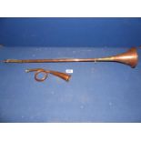 A vintage coiled copper Hunting Bugle and a copper hunting horn.