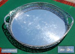 A superb Silver Tea Tray of large dimensions having a galleried edge profusely decorated with