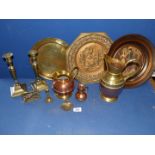 A quantity of brass chargers, ewers, etc.