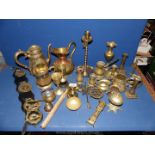 A box of mixed brass to include nightingale with four brasses, horses head stick, candlesticks,