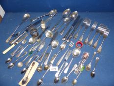 A quantity of miscellaneous spoons and forks including M.W.., W.H.