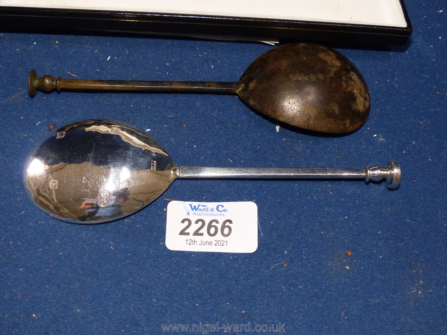A boxed London silver spoon dated 2001 and a Richard Ambrose spoon initialled R.
