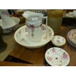 A white with rose decoration Minton bedroom set, including wash bowl,