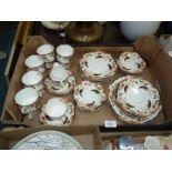 A part cream, brown and black Teaset including cups, saucers, tea plates etc., some hairline cracks.