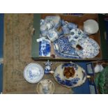 A quantity of blue and white china including a Delft meat plate, Blakeney vinegar and oil bottles,