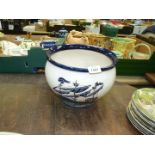 A large blue and white jardiniere with a sailing ship scene decoration, 8" x 10" diameter.