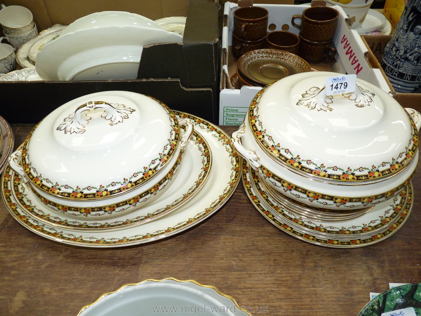 A part Losolware 'Burslem' dinner service in cream with an orange and lemon border,