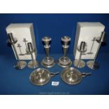 Three pairs of candlesticks and a pair of chambersticks.