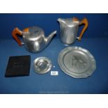 A Picquot ware teapot, coffee pot, pewter plate with horses head and boxed cast pewter dish.
