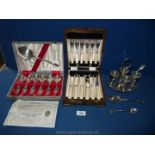 A cased set of Fish Eaters and Priestly & Moore dessert Spoons and forks with serving spoon,