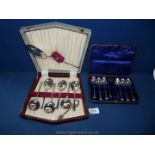 A boxed epns fruit spoon set with a boxed set of 6 teaspoons and sugar tongs and a Souvenir spoon