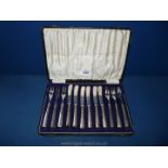 A cased set of silver handled dessert knives and forks with Deykins and Harris tines and blades,