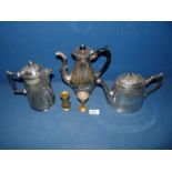 A plated teapot, coffee pot and hot water pot (not matching) and two small brass vases.