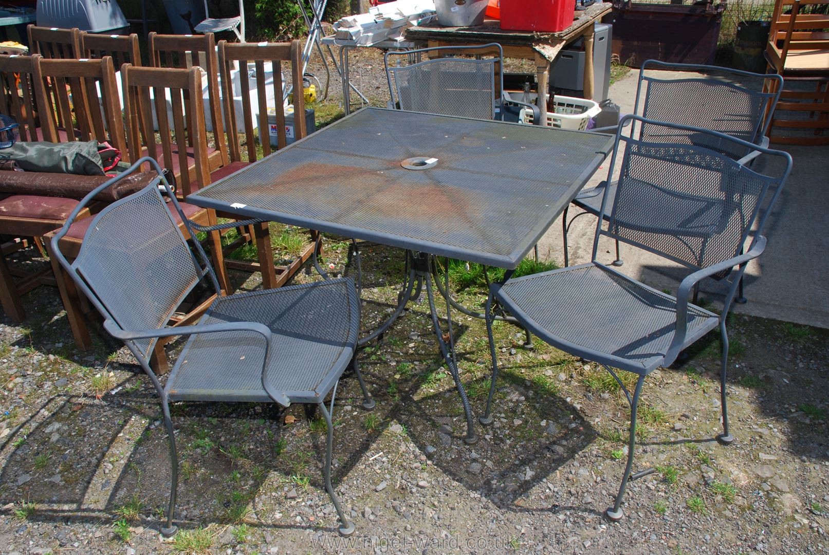 Four mesh work metal patio chairs and 3' square table.