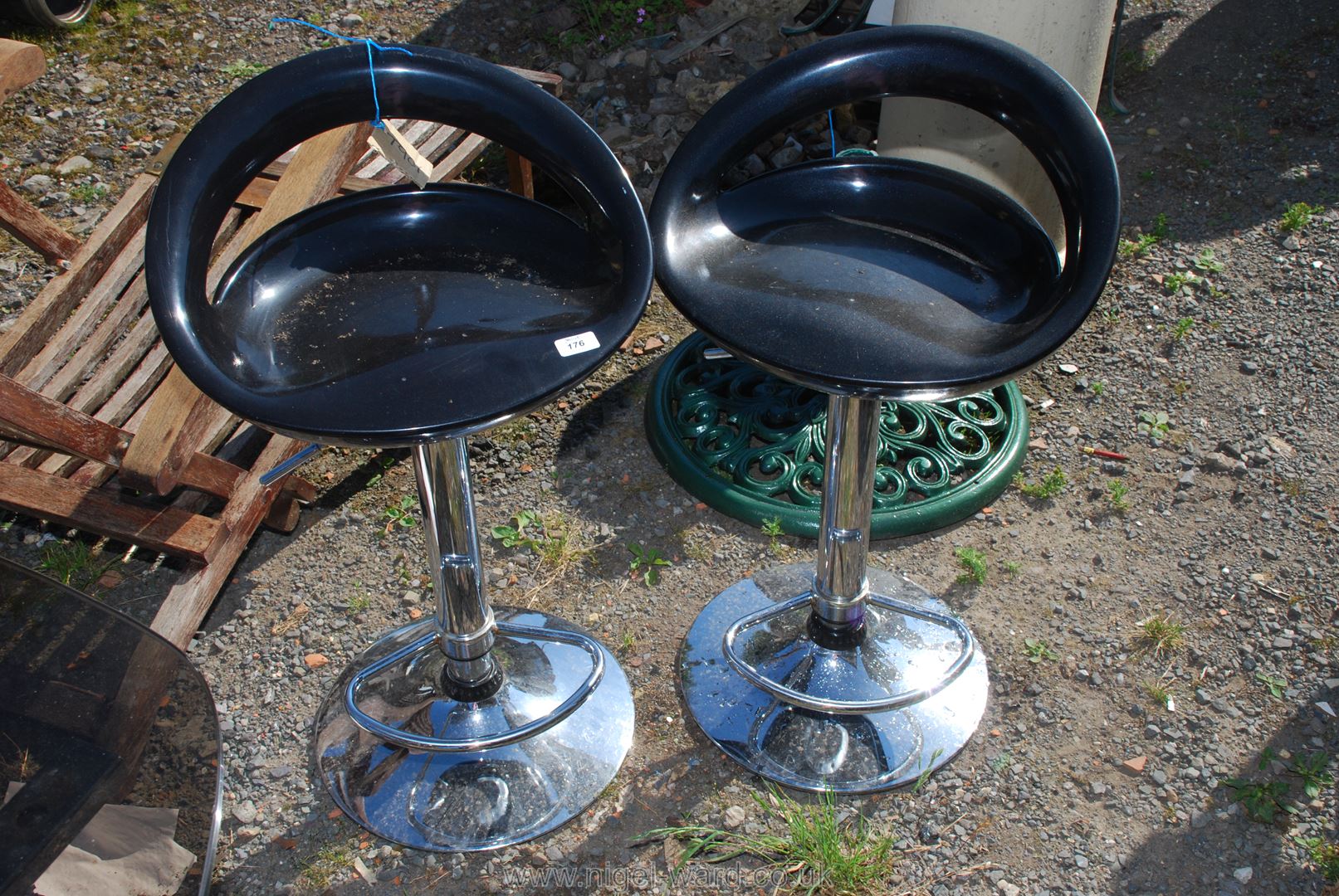 Pair of plastic seated and chrome bar stools