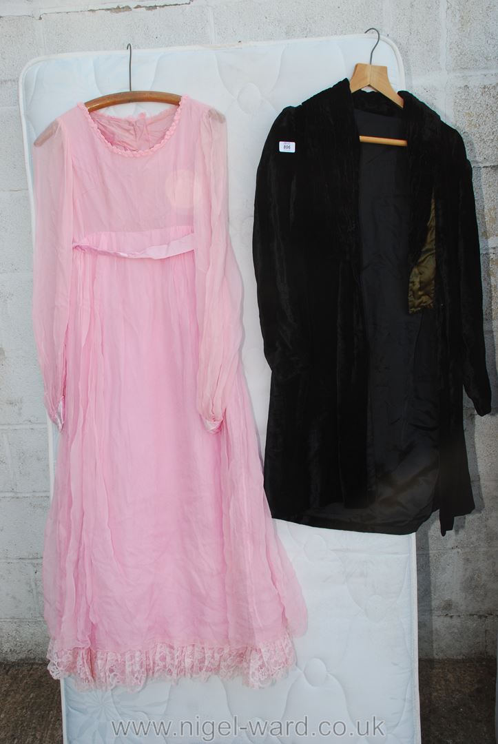 Pink adult size bridesmaid dress and a black coat.