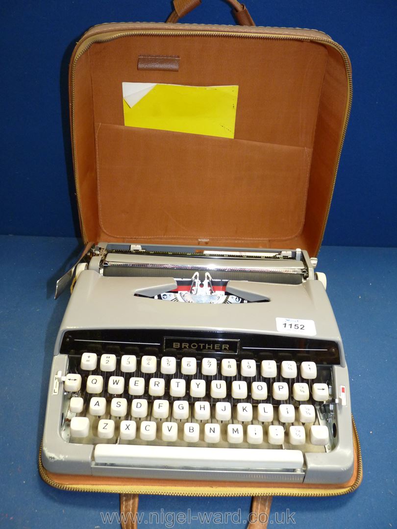 A Brother portable typewriter in brown case.