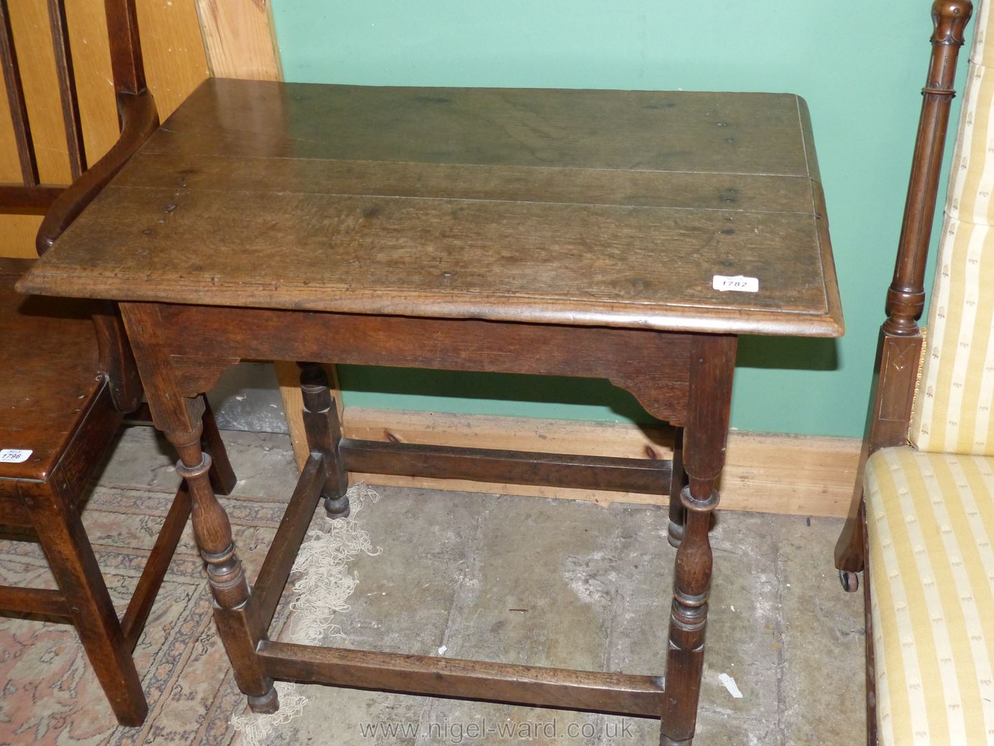 A 19th c. Oak Side Table on turned legs with perimeter stretchers, 30'' x 18 3/4'' x 27 5/8'' high.