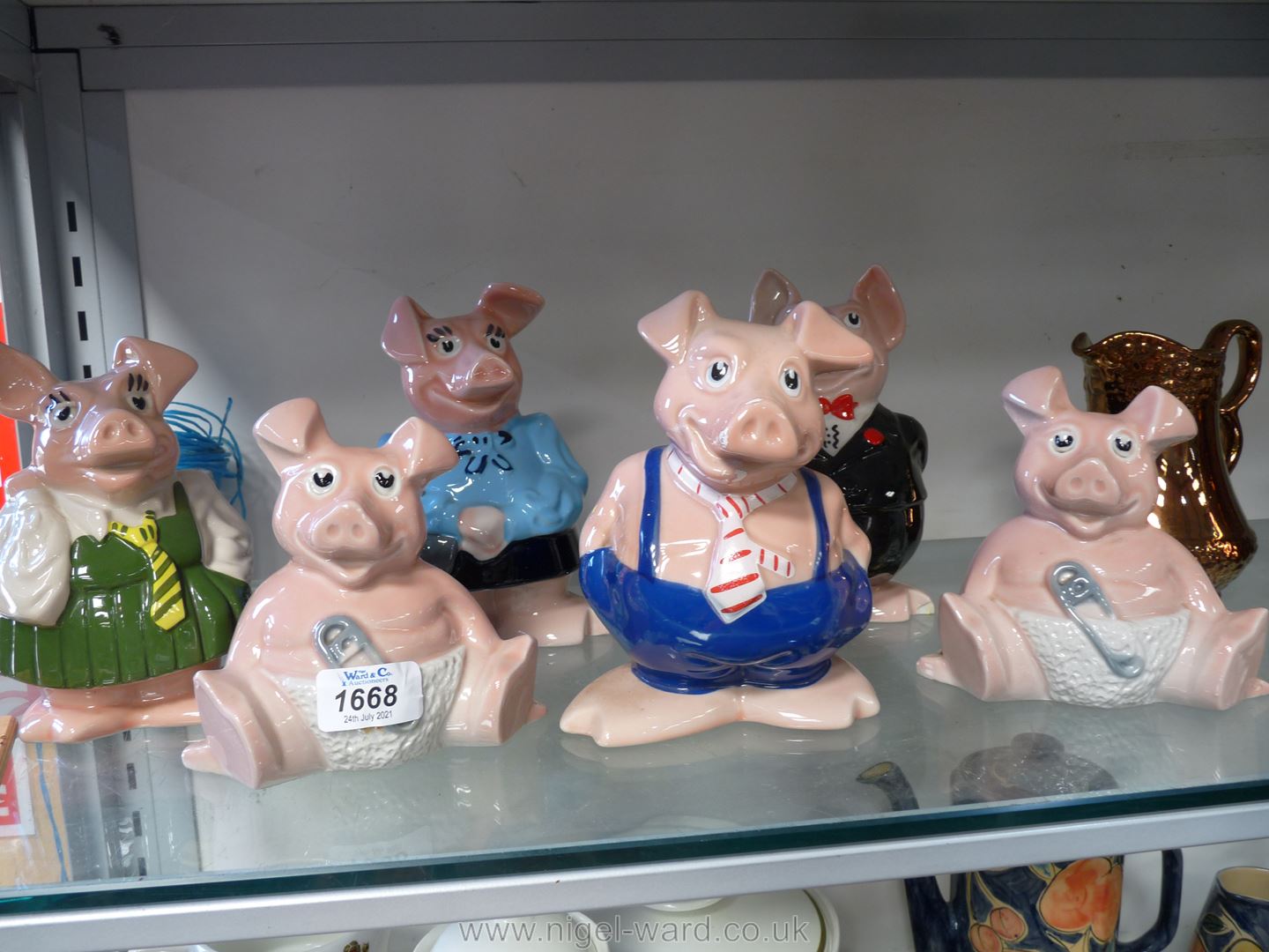 A family of Wade England NatWest pigs plus a second 'Baby' pig. - Image 2 of 2