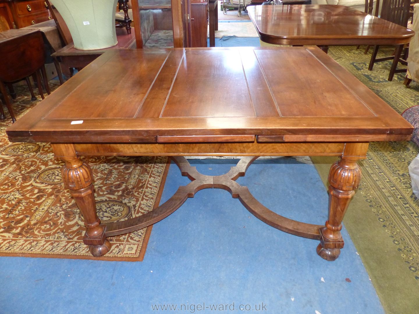 A Mahogany and Walnut draw leaf Dining Table standing on turned and tapering eight sided legs with - Image 2 of 2