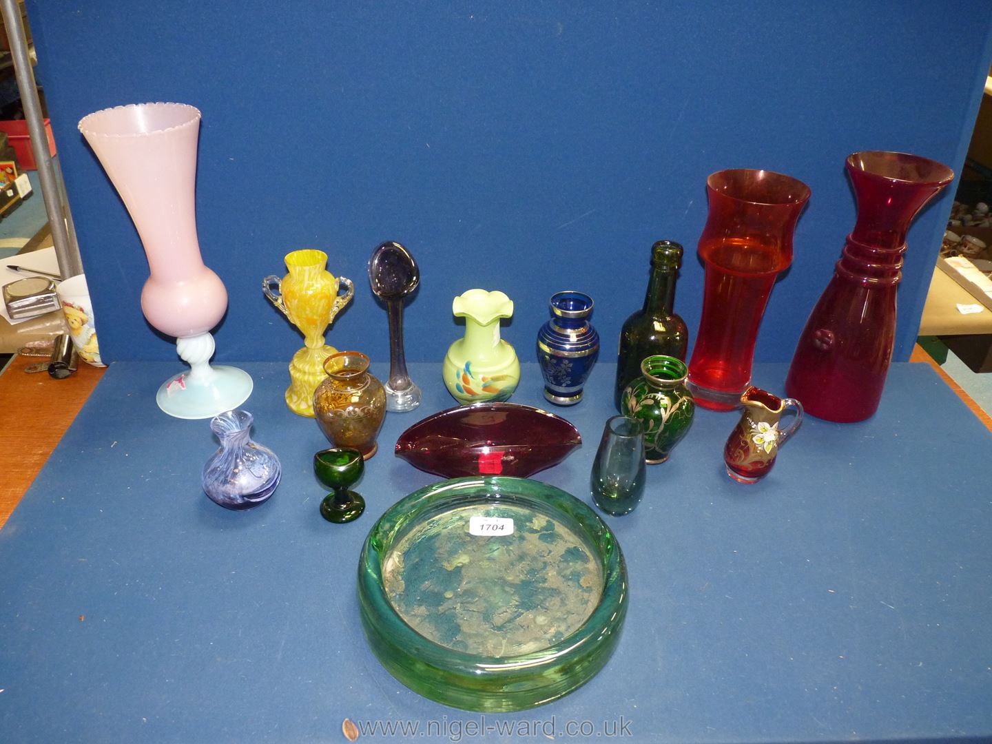 A small quantity of coloured glass including pink milk glass vase on footed stem,