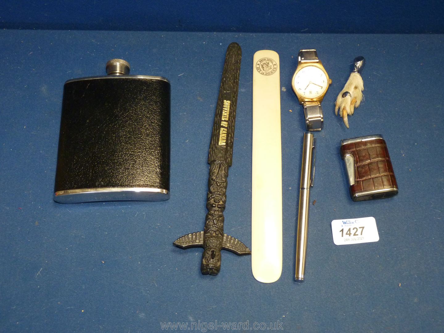 A small quantity of miscellanea to include bone page turner, flask, lighter, Osis mens watch,