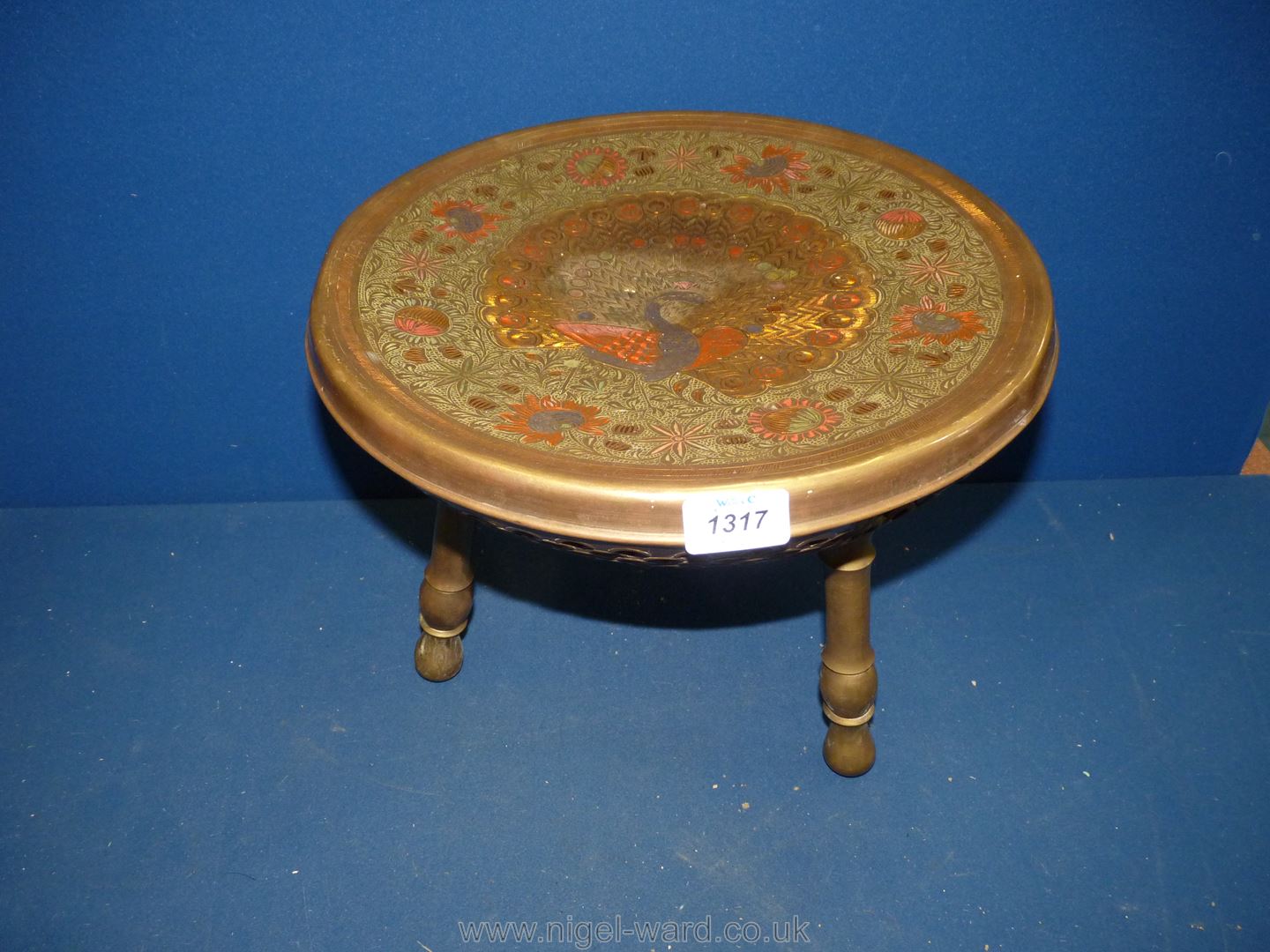 An unusual Indian brass and iron food warming low table,