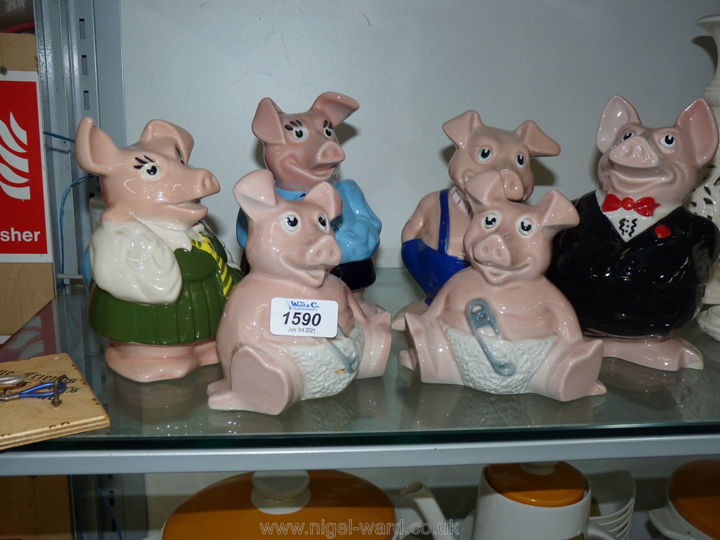 A family of Wade England NatWest pigs plus a second 'Baby' pig.