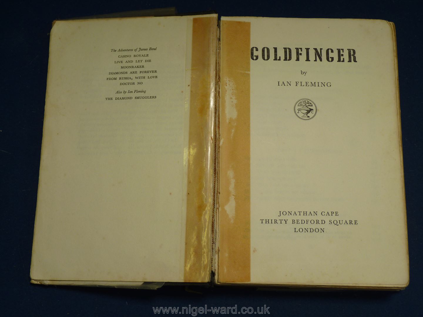 A first edition of 'Goldfinger' by Ian Fleming, Library edition, dust cover worn, loose binding. - Image 3 of 3